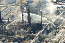 Emergency response workers fight secondary fires caused by the isomerization unit explosion at the Texas City refinery